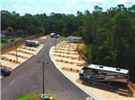 View larger image of A row of back in paved campsites at PENSACOLA NORTH RV RESORT image #6