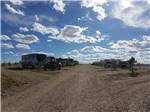 View larger image of A row of gravel RV sites at CUERVO MOUNTAIN RV PARK AND HORSE HOTEL image #1