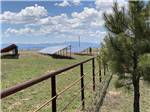 View larger image of A fence and a group of solar panels at CUERVO MOUNTAIN RV PARK AND HORSE HOTEL image #3