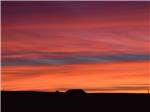 View larger image of Mountains at a red sunset at CUERVO MOUNTAIN RV PARK AND HORSE HOTEL image #12