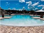 View larger image of The swimming pool area at ISLAND OAKS RV RESORT image #1