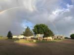 A rainbow over the campground at Bobcat Creek RV Park - thumbnail