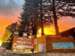 Sunset and pine trees at Midtown Mountain Campground & RV Park - thumbnail