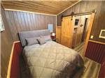 View larger image of The bedroom in one of the rental homes at KALISPEL RV RESORT image #9
