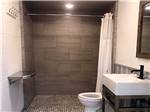 A bathroom with shower stall at CALYPSO COVE RV PARK - thumbnail