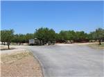 Paved road leading to sites at Cotulla Camp Resort - thumbnail