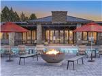 A fire pit in front of the pool at VERDE RANCH RV RESORT - thumbnail