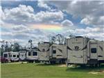 A row of trailers in RV sites at STAY N GO RV - thumbnail
