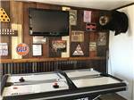 The game room with air hockey at Amigo Inn & RV Park - thumbnail