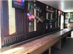 Indoor shuffleboard in the game room at Amigo Inn & RV Park - thumbnail