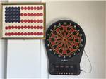 Dart board and American flag decor at Amigo Inn & RV Park - thumbnail