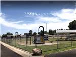 View larger image of The fenced in playground equipment at RANCHO SAN MANUEL MOBILE HOME  RV PARK image #3