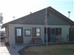Brick campground office with American flag at GOLDWATER MOBILE HOME & RV PARK - thumbnail