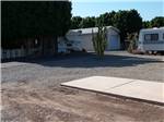 Gravel Campground site with patio at GOLDWATER MOBILE HOME & RV PARK - thumbnail