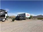 A couple of RVs in campsites at DESERT VIEW RV PARK - thumbnail