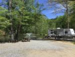 A travel trailer parked with a lake view at JENNY'S CREEK FAMILY CAMPGROUND - thumbnail