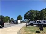 View larger image of Sidewalk with RVs parked on either side at TEXARKANA RV PARK image #9