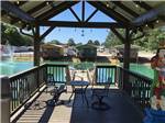 View larger image of Walkway stretches out over a pond with fountain at TEXARKANA RV PARK image #10