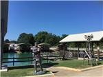 View larger image of Statue of frontiersman in front of pond at TEXARKANA RV PARK image #11