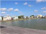 View larger image of A group of rental cabins by the water at R  R RV RESORT  CASITAS image #7