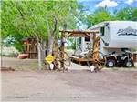 Fifth-wheel with wooden entrance at ST JOHNS RV RESORT - thumbnail