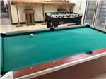 View larger image of Pool table and foosball table in rec room at CHEWING BLACK BONES CAMPGROUND image #5