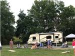 View larger image of People playing cornhole at JUST PLANE ADVENTURES LODGING  CAMPGROUND image #8