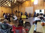 View larger image of A band playing in the recreation hall at JUST PLANE ADVENTURES LODGING  CAMPGROUND image #10