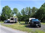 View larger image of A line of gravel back in RV sites at JUST PLANE ADVENTURES LODGING  CAMPGROUND image #11
