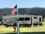 Trailer in a grassy RV site - thumbnail