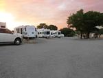 RVs in campsites at sunset - thumbnail