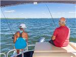 View larger image of A man and woman fishing from a boat at STEINHATCHEE RIVER CLUB image #3