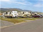 A row of trailers and fifth wheels in sites at COPPER COURT RV PARK - thumbnail