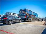 Motorhomes and cars parked at COTA CAMPING-PREMIUM RV PARK - thumbnail
