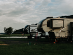 Sites by a small pond at Greensport RV Park & Campground - thumbnail