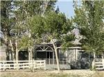 View larger image of Front view of house with white picket fence at LAKE OLANCHA RV PARK image #8