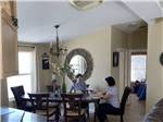 View larger image of People sitting around dining room table at LAKE OLANCHA RV PARK image #9