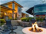 A fire pit burning with a motorhome in the back at MOTORCOACH RESORT LAKE ERIE SHORES - thumbnail