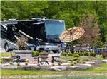 A motorhome parked in a paved site at MOTORCOACH RESORT LAKE ERIE SHORES - thumbnail