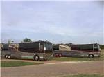View larger image of A couple of bus conversions in RV sites at DINOSAUR VALLEY RV PARK image #5