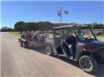 People riding on a flat bed trailer at DINOSAUR VALLEY RV PARK - thumbnail
