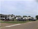 View larger image of A row of RVs in gravel RV sites at DINOSAUR VALLEY RV PARK image #11