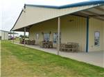 View larger image of The outside covered patio at BRAZOS TRAIL RV PARK image #6
