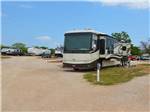 A row of gravel RV sites at FREEDOM LIVES RANCH RV RESORT - thumbnail