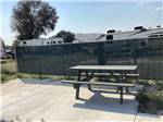 View larger image of A picnic table at one of the RV sites at DILLON MOTORCOACH  RV PARK image #12
