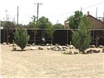 Some of the empty gravel RV sites at COOL SUNSHINE RV PARK - thumbnail