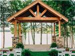 A wooden pavilion overlooking the water at TWIN CREEKS RV RESORT - thumbnail