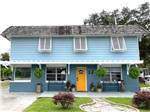 Two story blue clapboard house at SUNNY OAKS RV PARK - thumbnail