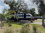 Another trailer parked in a RV site at SUNNY OAKS RV PARK - thumbnail