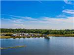 View larger image of A view of the campsites from the water at COOKS LAKE RV RESORT  CAMPGROUND image #1